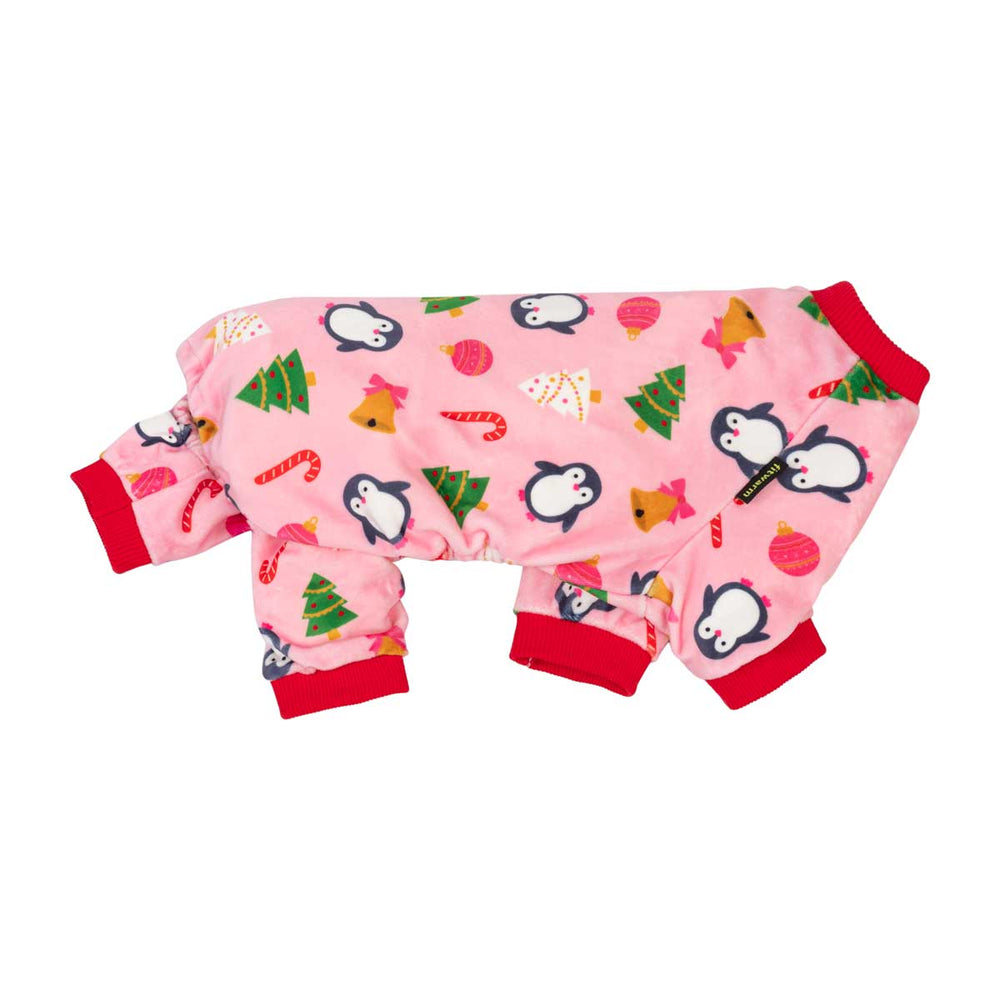 Pink dog pjs with a Christmas print featuring penguins, Christmas trees, candy canes, ornaments, and a reindeer, finished with red cuffs and collar
