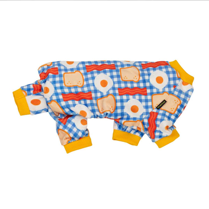 Side view of small dog fleece pajama featuring a breakfast-themed print with a blue gingham background, eggs, bacon, and toast, finished with yellow cuffs