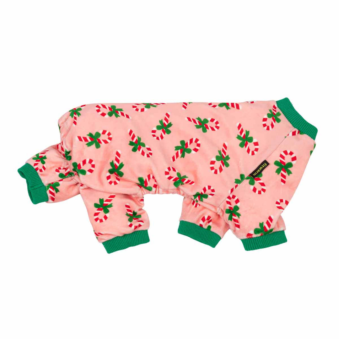 Pink Christmas dog pajamas with red and white candy cane print and green trim.