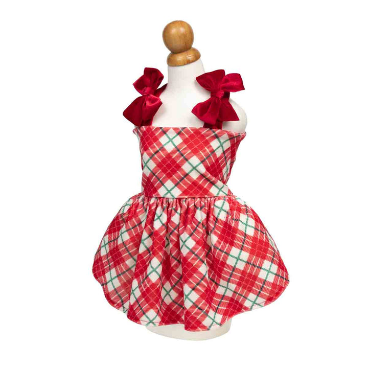 Red and white plaid dress for dogs displayed on a white mannequin dress,featuring a red and white plaid pattern with green accent lines and red satin bows on the shoulder straps