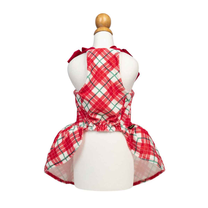 Red, white, and green plaid dog Christmas dress displayed on a white mannequin torso against a plain white background