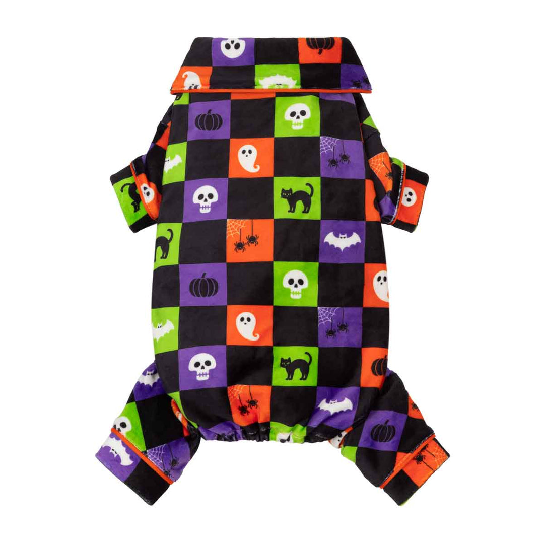 Spooky dog Halloween pjs with a colorful checkered pattern of black, orange, purple, and green squares featuring cartoon ghosts, pumpkins, skulls, spiders, and bats, shown on a plain white background