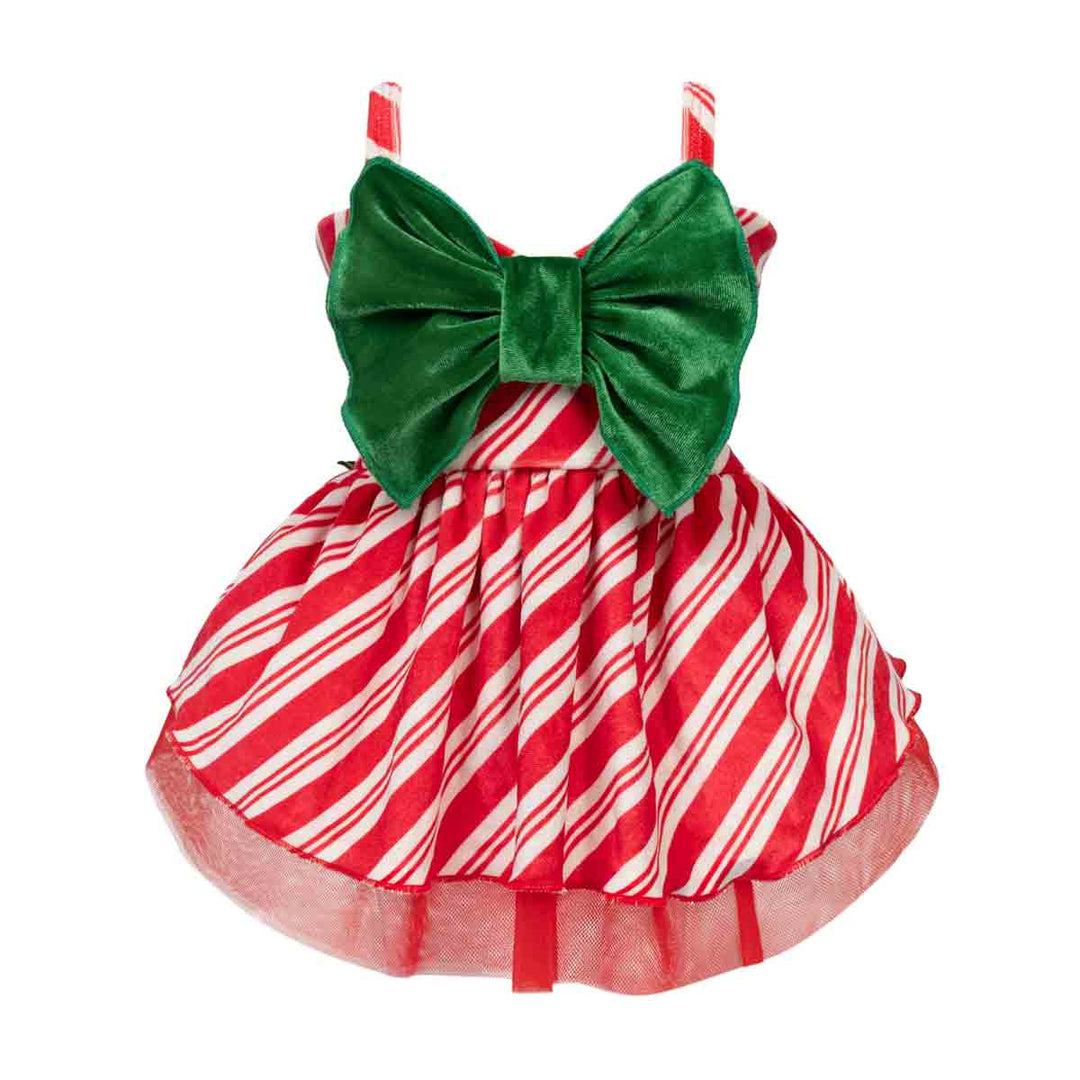 Christmas dress for dogs with a red and white candy cane striped skirt, red and white striped shoulder straps, and a large green velvet bow