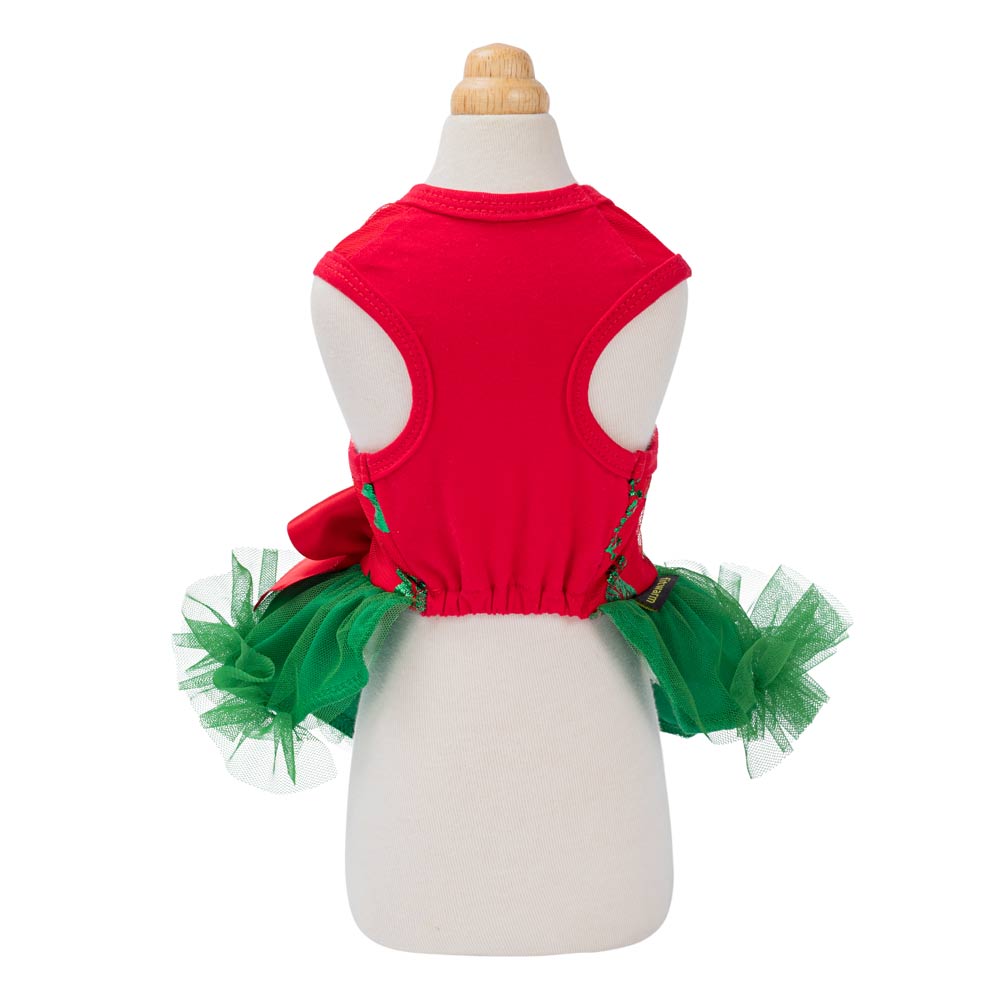 Festive red dog tutu dress with green tulle skirt and bow, showcasing holiday design for dogs.