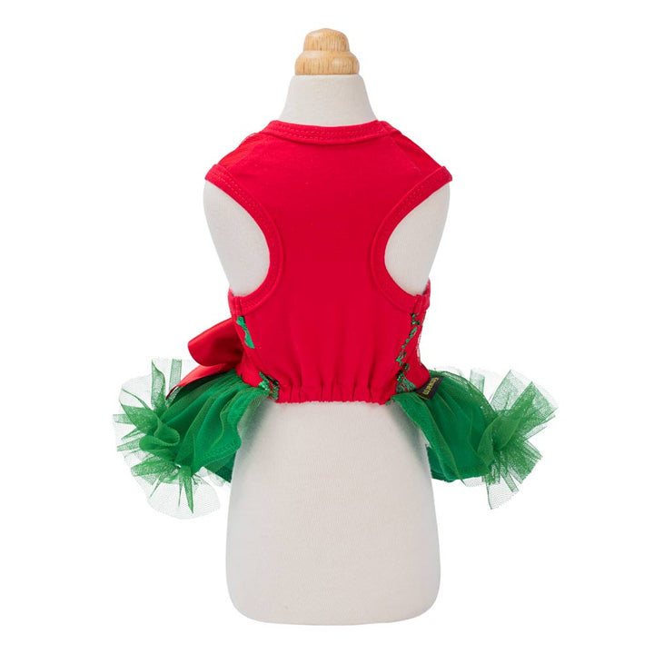 Festive red dog tutu dress with green tulle skirt and bow, showcasing holiday design for dogs.