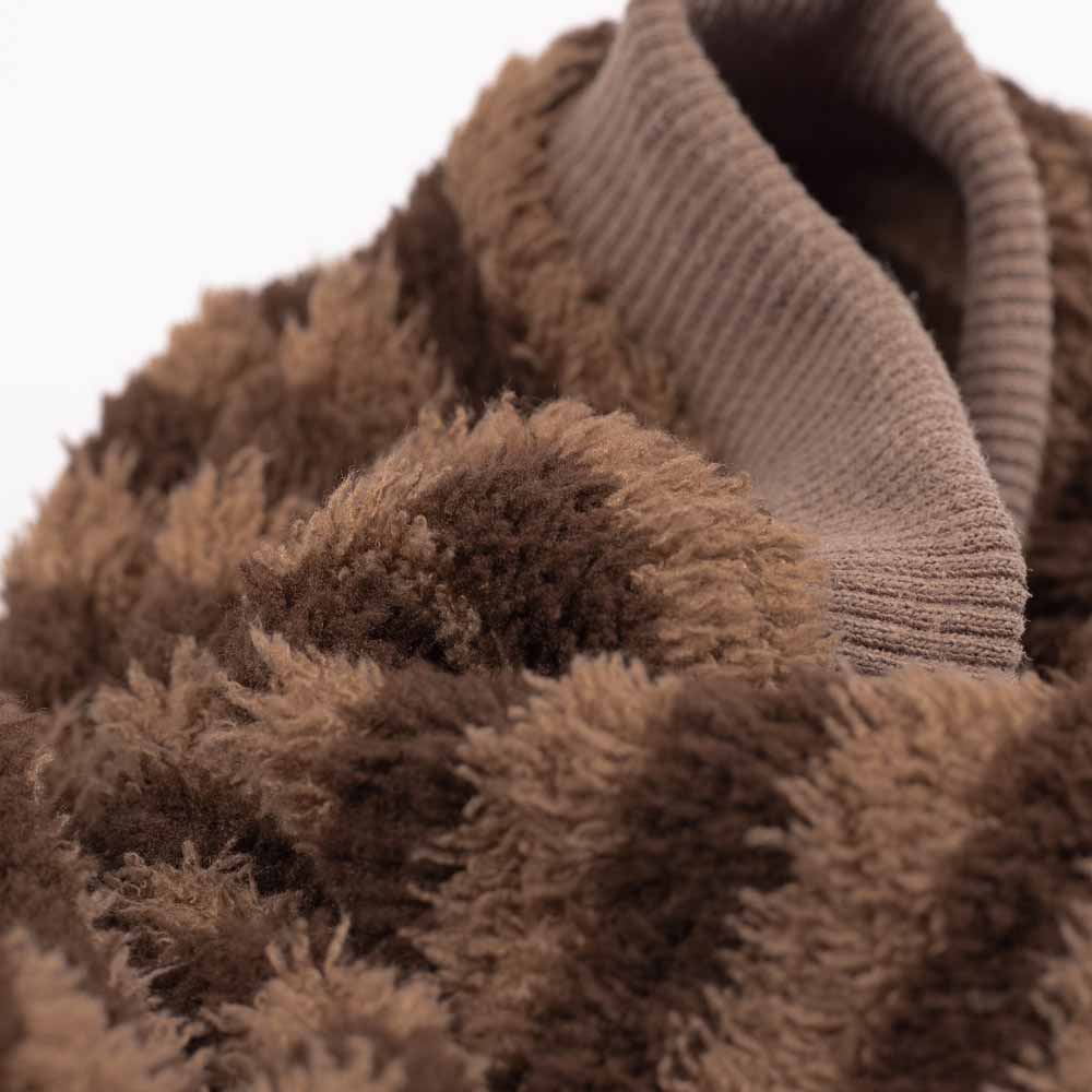 Close-up of brown textured fabric with a ribbed texture