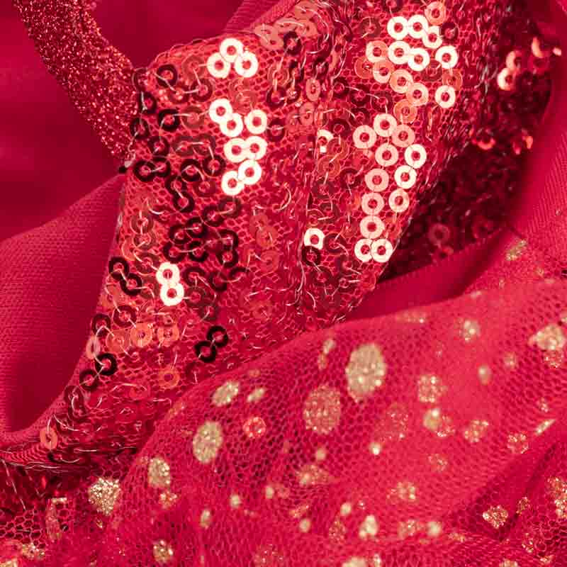 Detailed view of red sequin fabric and glitter mesh layers from a glamorous dog dress.