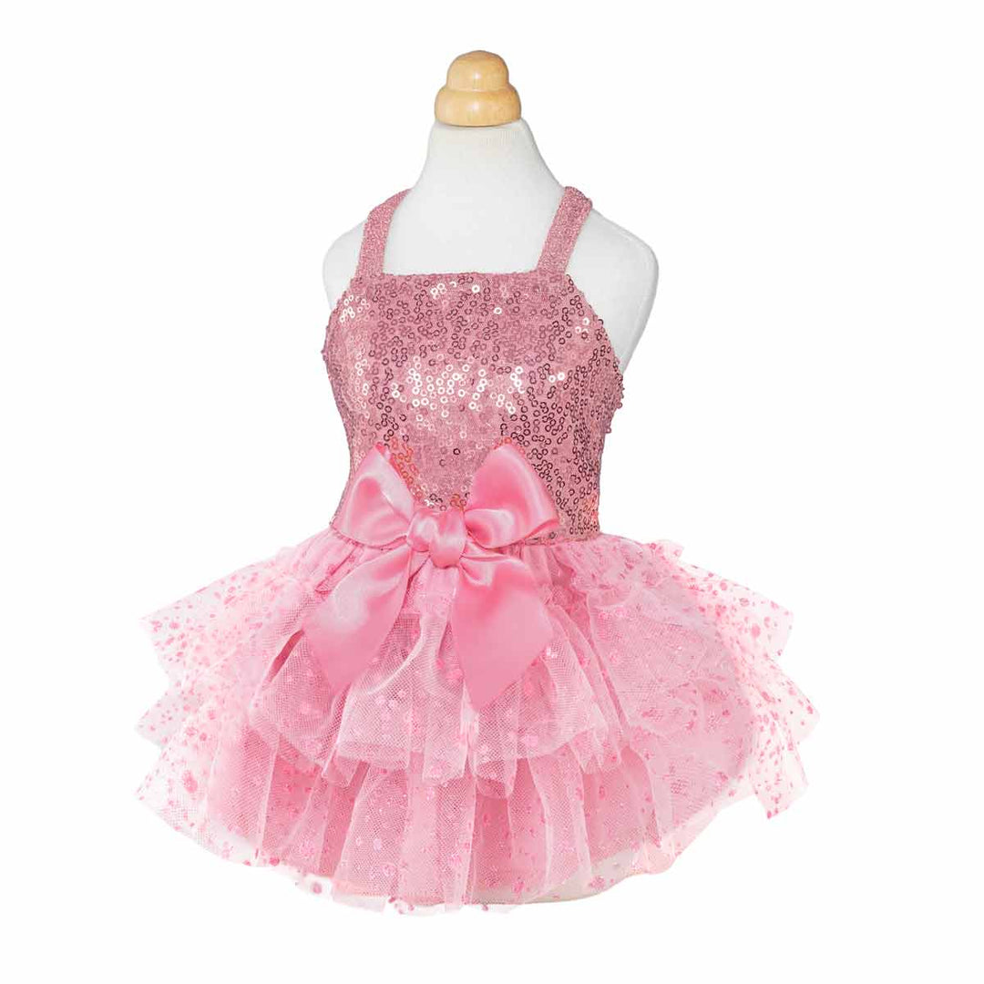 Elegant pink dog dress featuring sequin top, tiered tulle skirt, and soft pink bow.