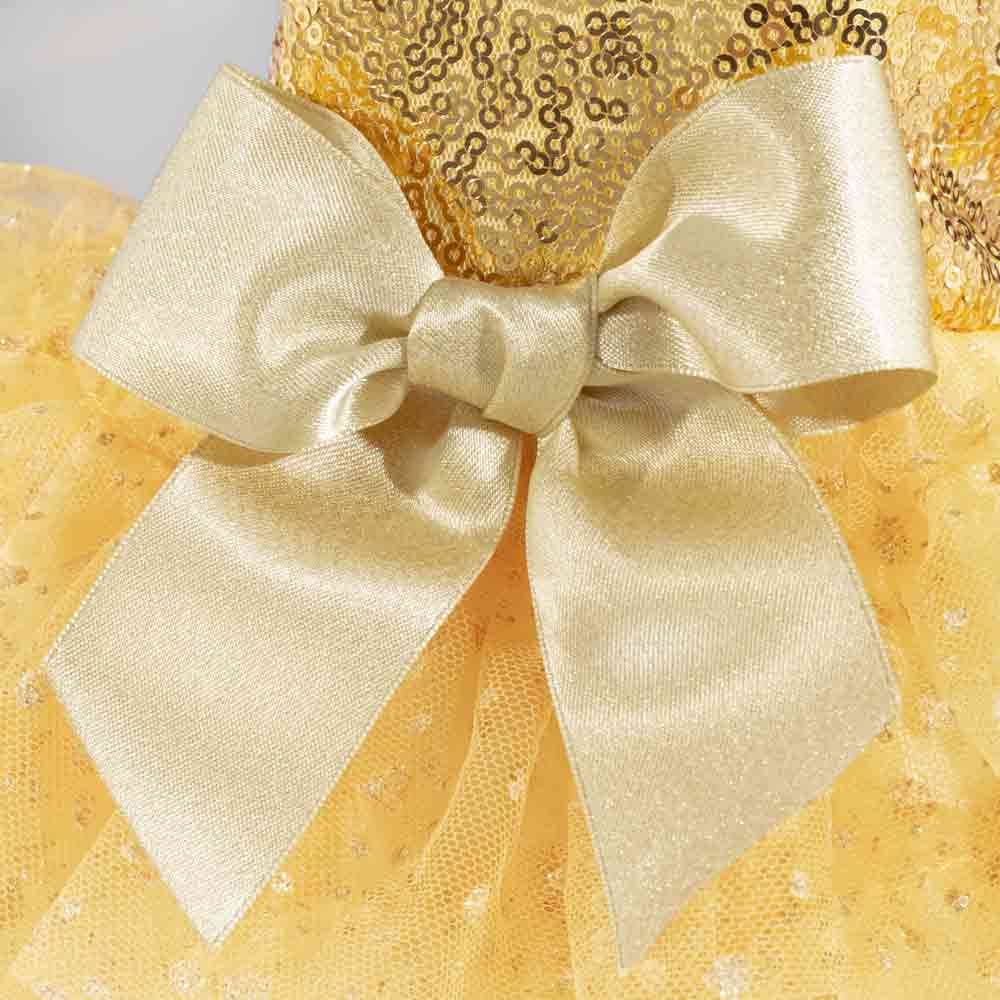 Close-up of gold satin bow on sparkly sequin dog pajamas with tulle skirt.