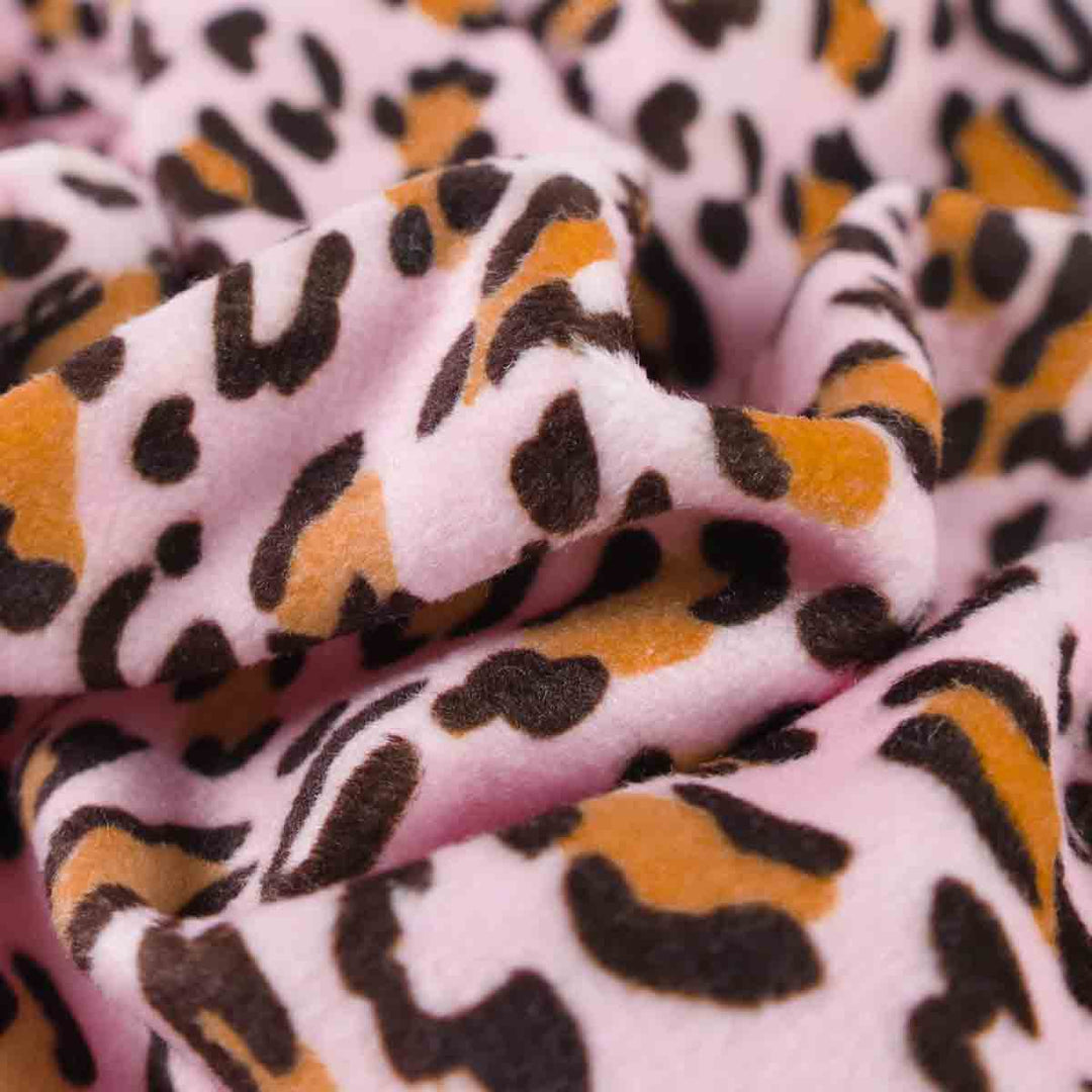 Pink leopard print dog pajamas fabric detail. Soft, breathable material for comfort.
