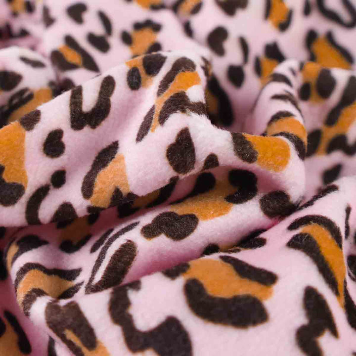 Pink leopard print dog pajamas fabric detail. Soft, breathable material for comfort.