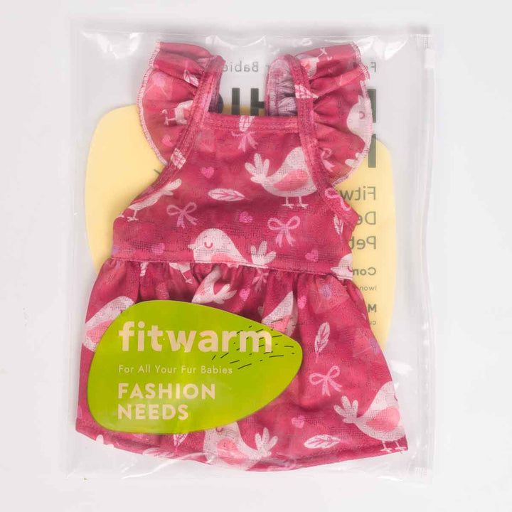 Dog dress packaged in a clear Fitwarm bag showing the pink bird-print dress with ruffled straps