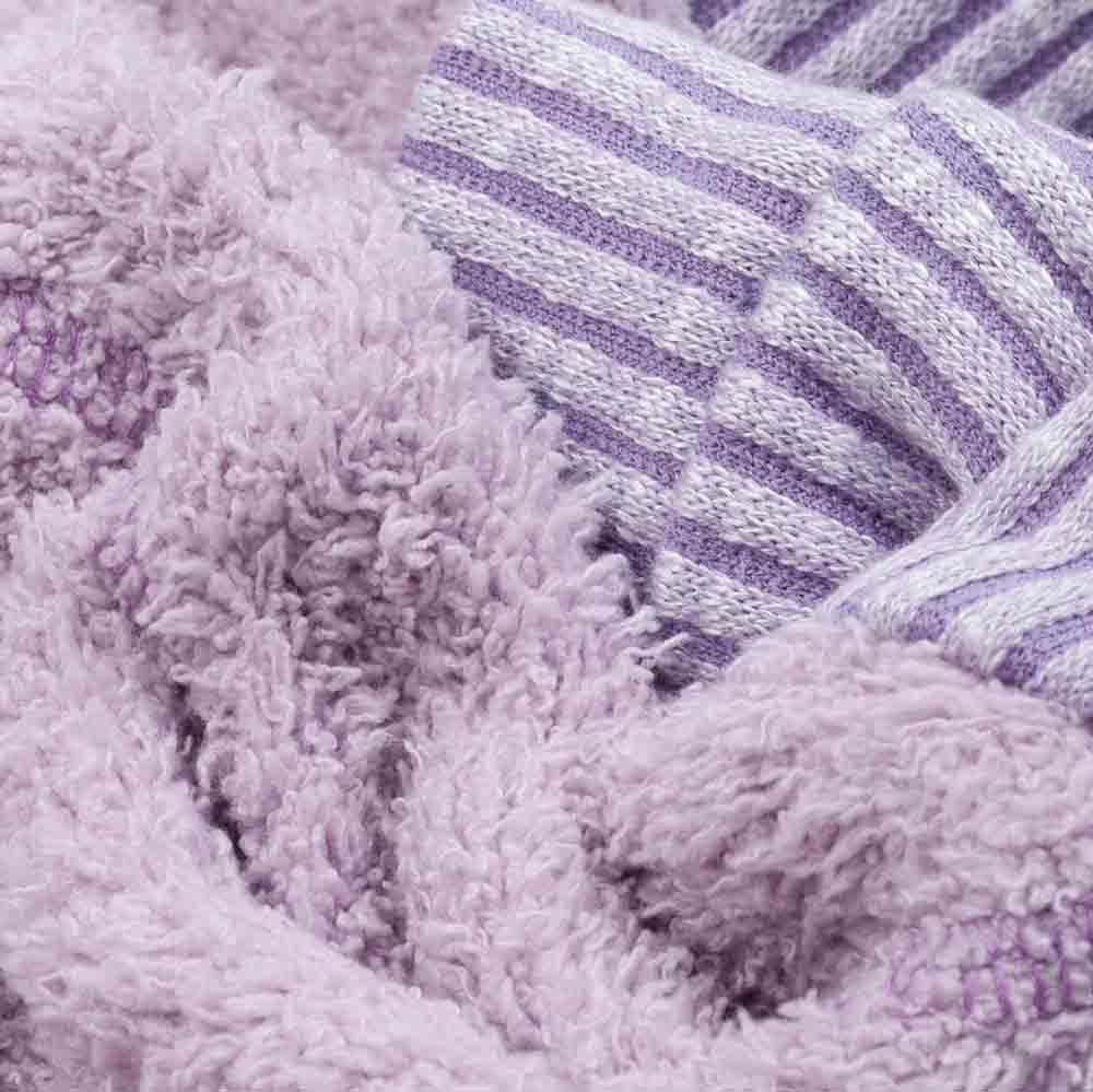 Close-up of lilac double face fleece and striped rib trim on cozy dog pajamas.