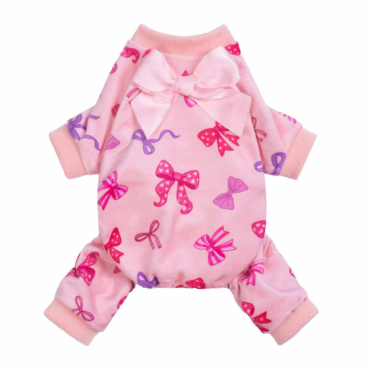 Pink dog pajamas featuring an allover bow pattern with a large satin bow detail on the back.