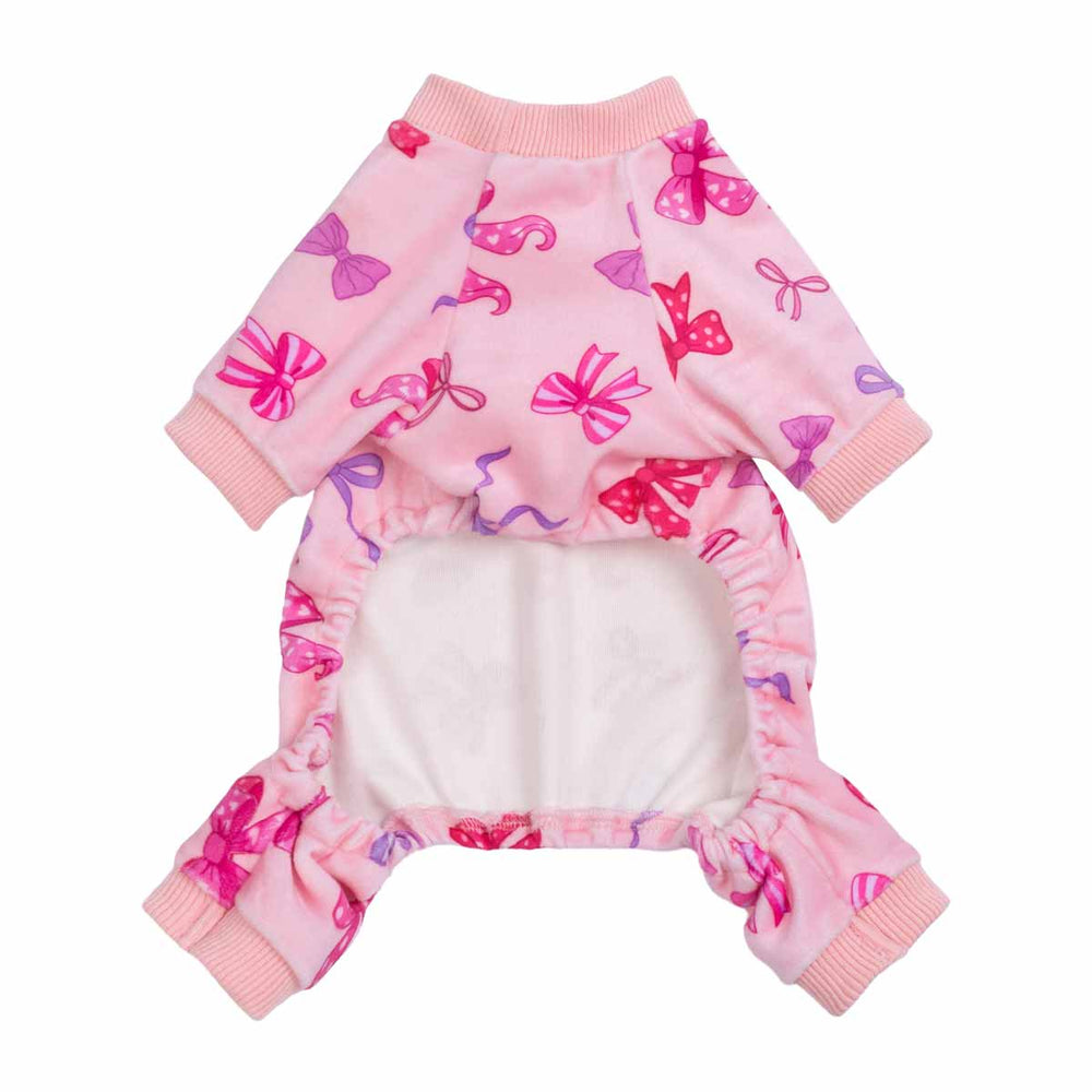 Pink dog pajamas shown from the underside, decorated with colorful bow designs and ribbed cuffs.