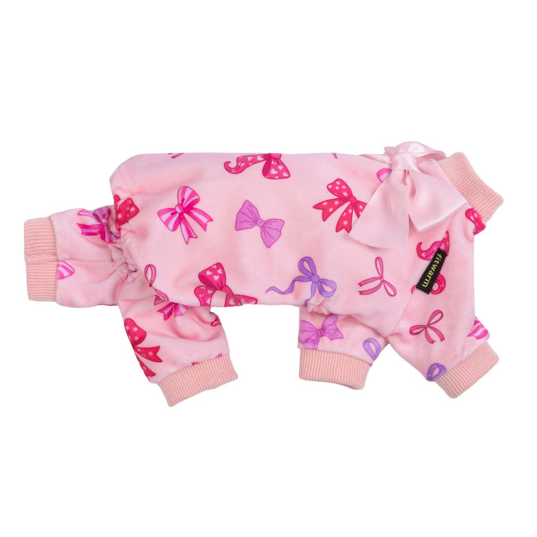 Side view of pink dog pajamas with vibrant bow prints and a satin bow accent near the neckline.