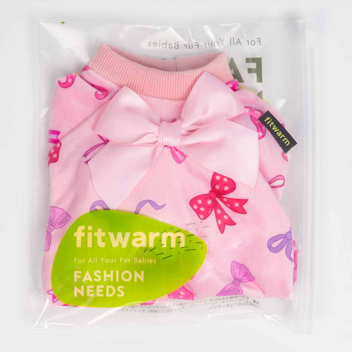 Packaged pink dog pajamas with bow designs displayed inside a clear Fitwarm branded bag.