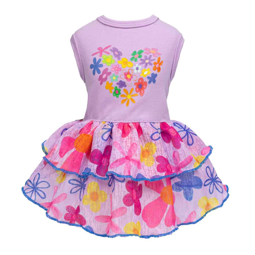 Front view of purple floral dog dress with heart-shaped flower graphic and layered skirt.