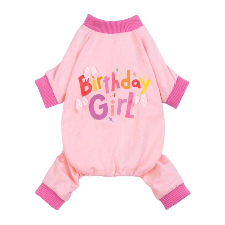 Pink birthday girl dog pajamas with colorful lettering and bow details on a full-coverage design.