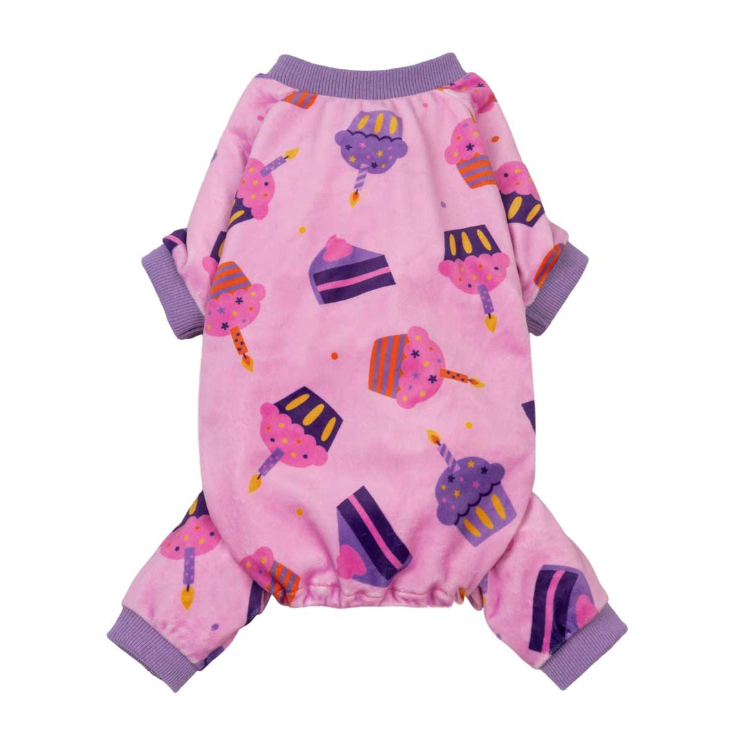 Birthday pajamas for dogswith a colorful cupcake and cake slice with candle print, featuring purple ribbed cuffs and collar, shown on a white background