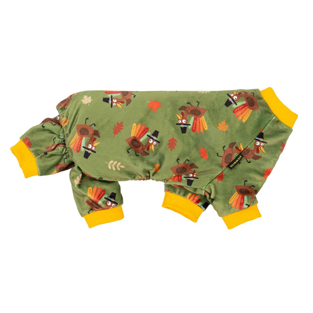 Small dog fleece pajama set laid flat on a white background, featuring an olive green fabric with a Thanksgiving turkey print and bright yellow cuffs