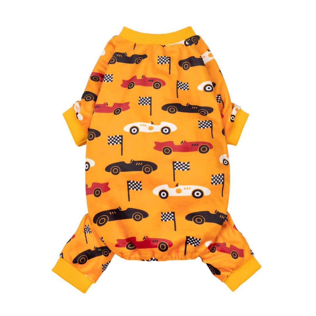 Yellow-orange dog jumpsuit with a colorful race car and checkered flag print, shown flat on a white background