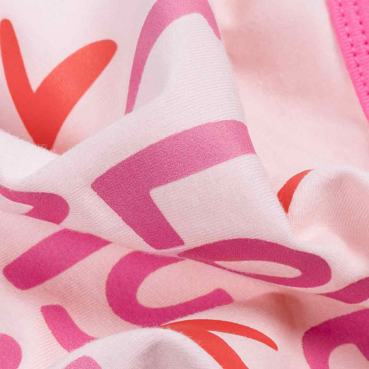 Close-up of pink and red heart patterns on a fabric surface
