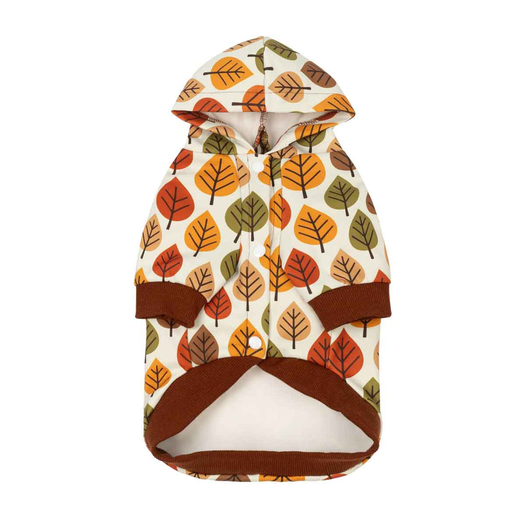 Hooded dog sweatshirt with an autumn leaf pattern in orange, brown, and green on a cream background, featuring solid brown trim