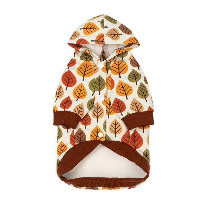 Hooded dog sweatshirt with an autumn leaf pattern in orange, brown, and green on a cream background, featuring solid brown trim
