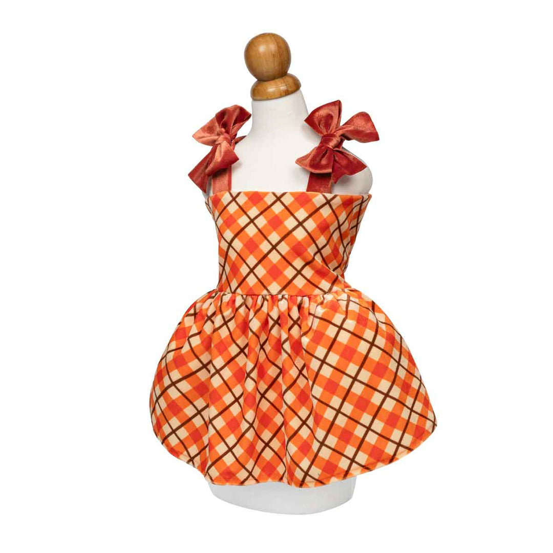 Fall dog sleeveless dress with a orange and beige plaid pattern, featuring two large red satin bows on the shoulders, displayed on a white mannequin dress form against a white background