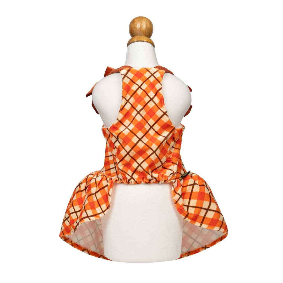 Sleeveless orange plaid dog dress displayed on a white mannequin torso with a wooden finial, shown from the back against a plain white background