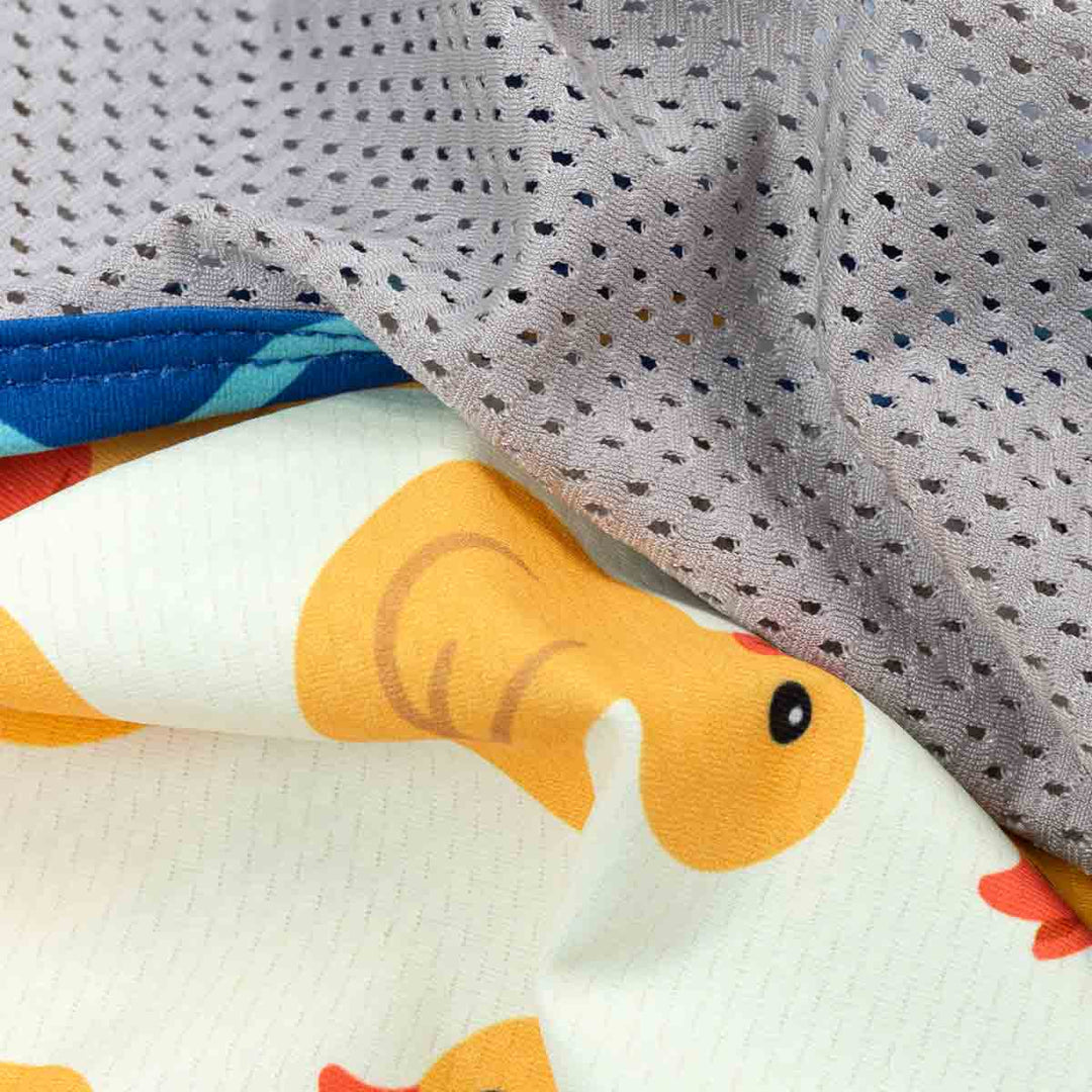 Lightweight dog UV shirt fabric with yellow duck print and breathable grey mesh.