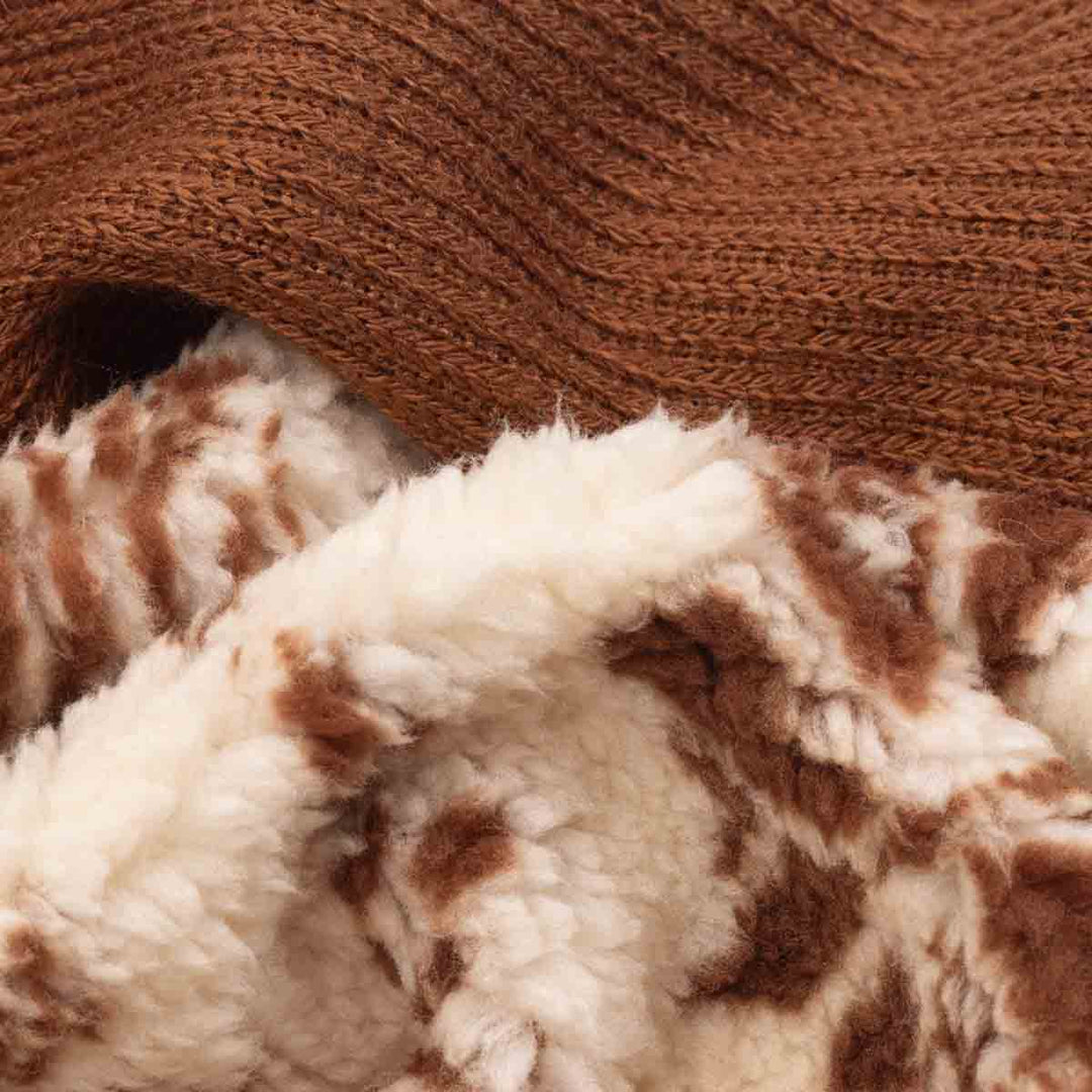 Macro close-up of dog hoodie double face fleece fabric showing soft plush texture and layered warmth