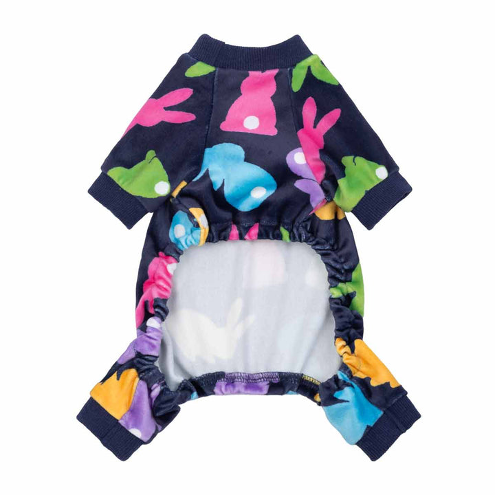 Back view of navy dog pajamas with colorful bunny print and elastic belly opening.
