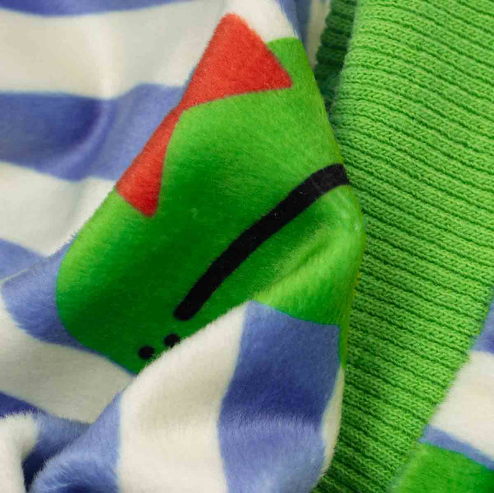 Close-up of fabric with frog print on a striped fabric background