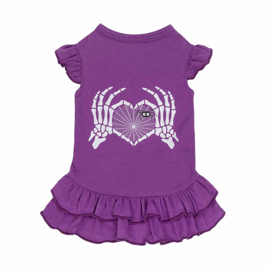 Purple dog Halloween dress with a skeleton hands heart and ruffle design on a white background