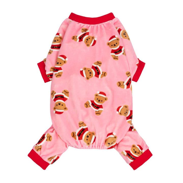 Pink dog pjst with a teddy bear with Santa Claus outfit pattern and red trim, shown flat on a white background