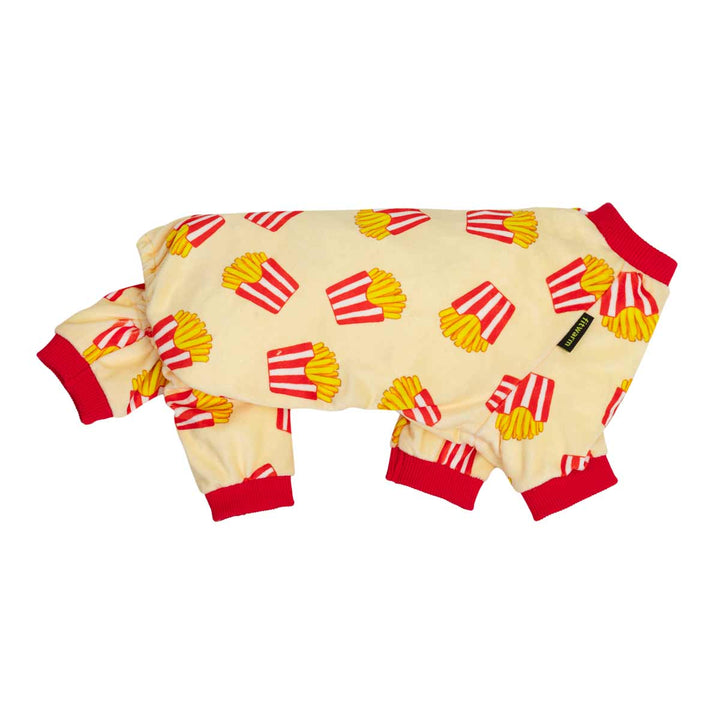 Side view of pajamas for dogs featuring a yellow and red french fries pattern on a cream-colored background, with red trim on the collar, cuffs, and legs