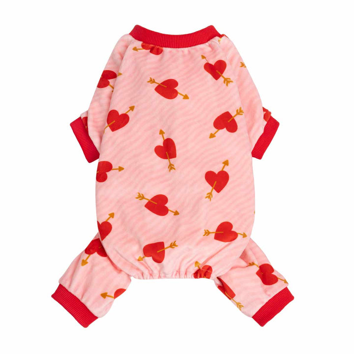 Pink dog pjs with red heart and arrow pattern, red collar and cuffs, shown on a plain white background