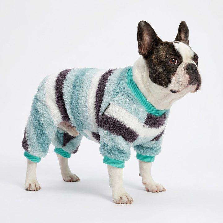 French bulldog wearing striped dog pjs with plush textured fabric