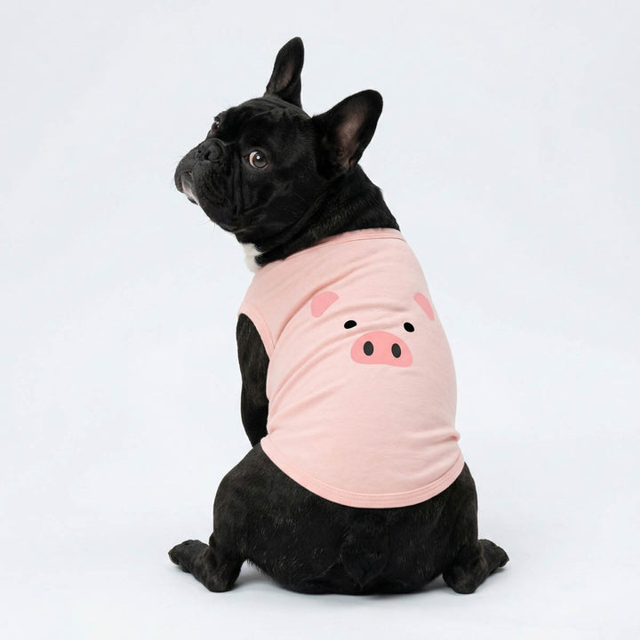 French Bulldog wears a cute pig dog tank top and looks back