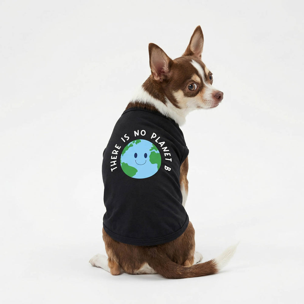 Chihuahua looks back with a the earth day themed dog tank top 