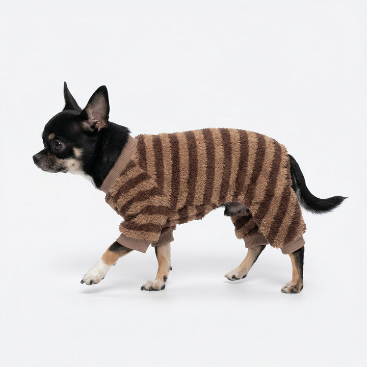 Side view of dog wearing striped dog onesie
