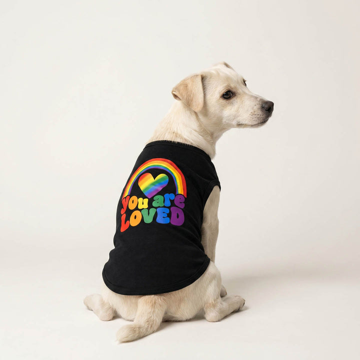 Back view of small dog in a black dog tank top with rainbow prints and 'You are loved' lettering