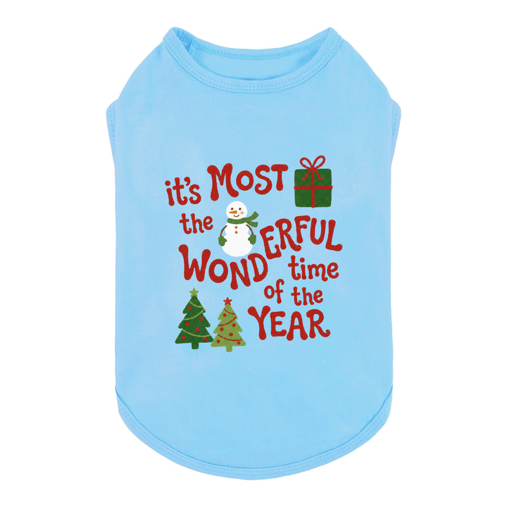 Light blue dog tank top featuring a festive Christmas graphic with the text 'it's Most the wonderful time of the year' in red, accompanied by a snowman, gift box, and Christmas trees