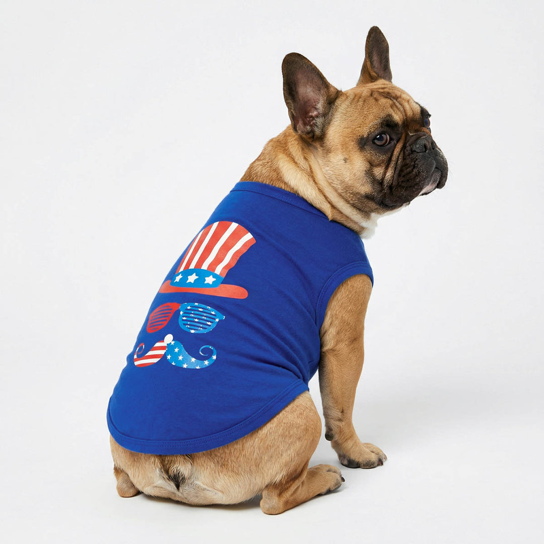 French Bulldog wearing a blue patriotic dog shirt with red, white, and blue striped hat and mustache print.