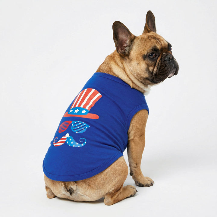 French Bulldog wearing a blue patriotic dog shirt with red, white, and blue striped hat and mustache print.