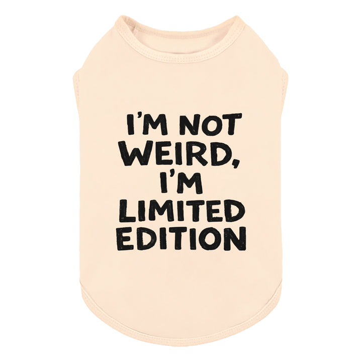 Cream dog shirt with bold “I’m Not Weird, I’m Limited Edition” lettering on front.