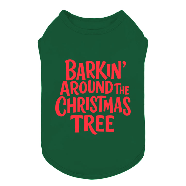 Green dog shirt with red “Barkin’ Around the Christmas Tree” text design for festive style.