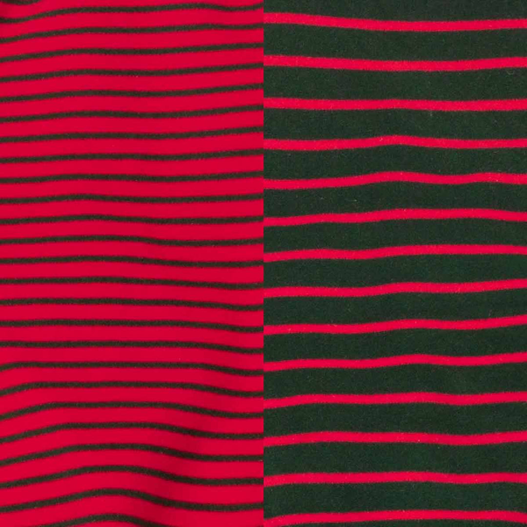 Close-up of a striped fabric pattern with alternating red and dark green horizontal stripes, split vertically into two sections